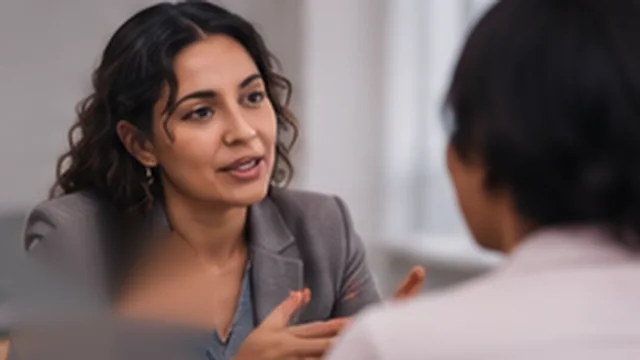 Interpreter speaking with a client